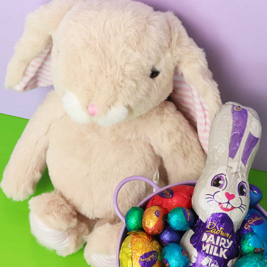 Easter basket with Cadbury eggs and a plush bunny