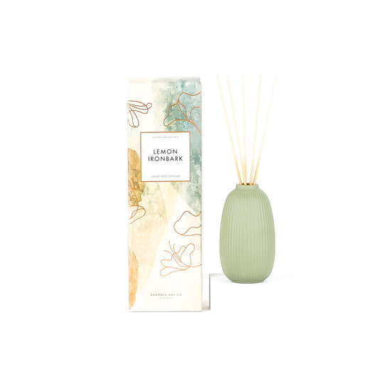 Green diffuser bottle with packaging labeled 'Lemon Ironbark' on a white background