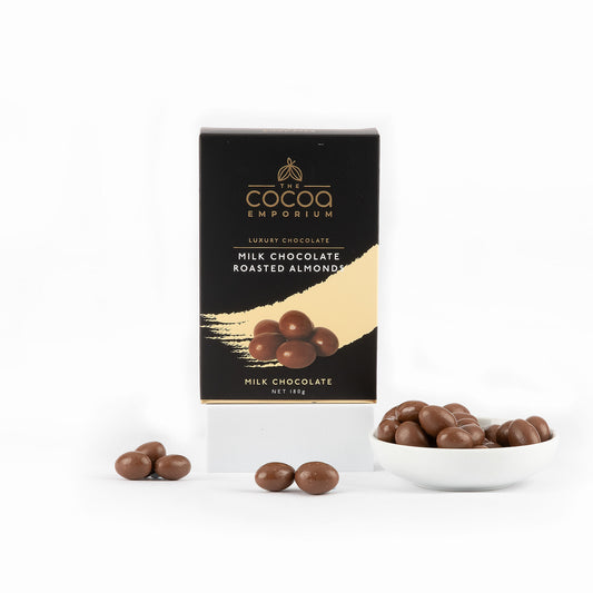 Cocoa Emporium milk chocolate roasted almonds packaging with chocolates on a white background