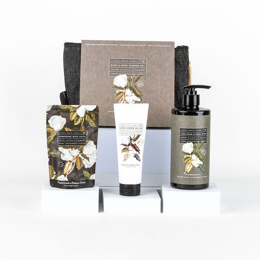 Set of skincare products with floral design packaging on a white background