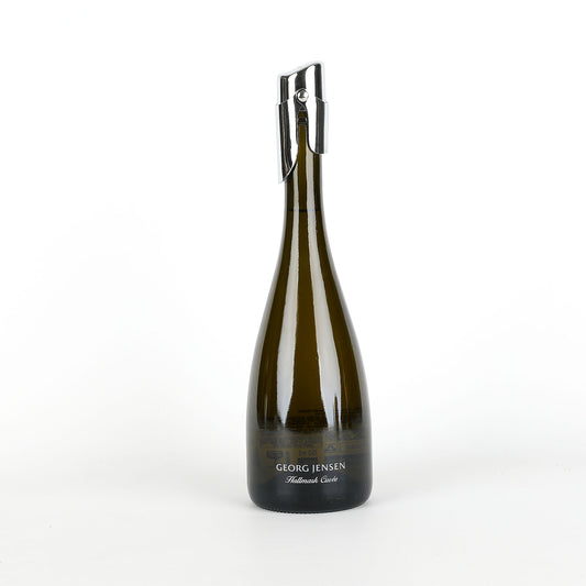 Bottle of sparkling wine with a silver cap on a white background