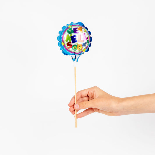 Hand holding a colourful balloon with 'Get Well Soon' text on a white background