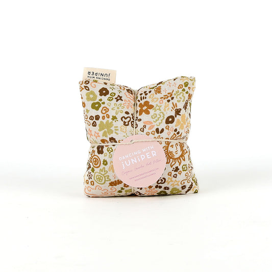 Floral-patterned heat pillow on a white background