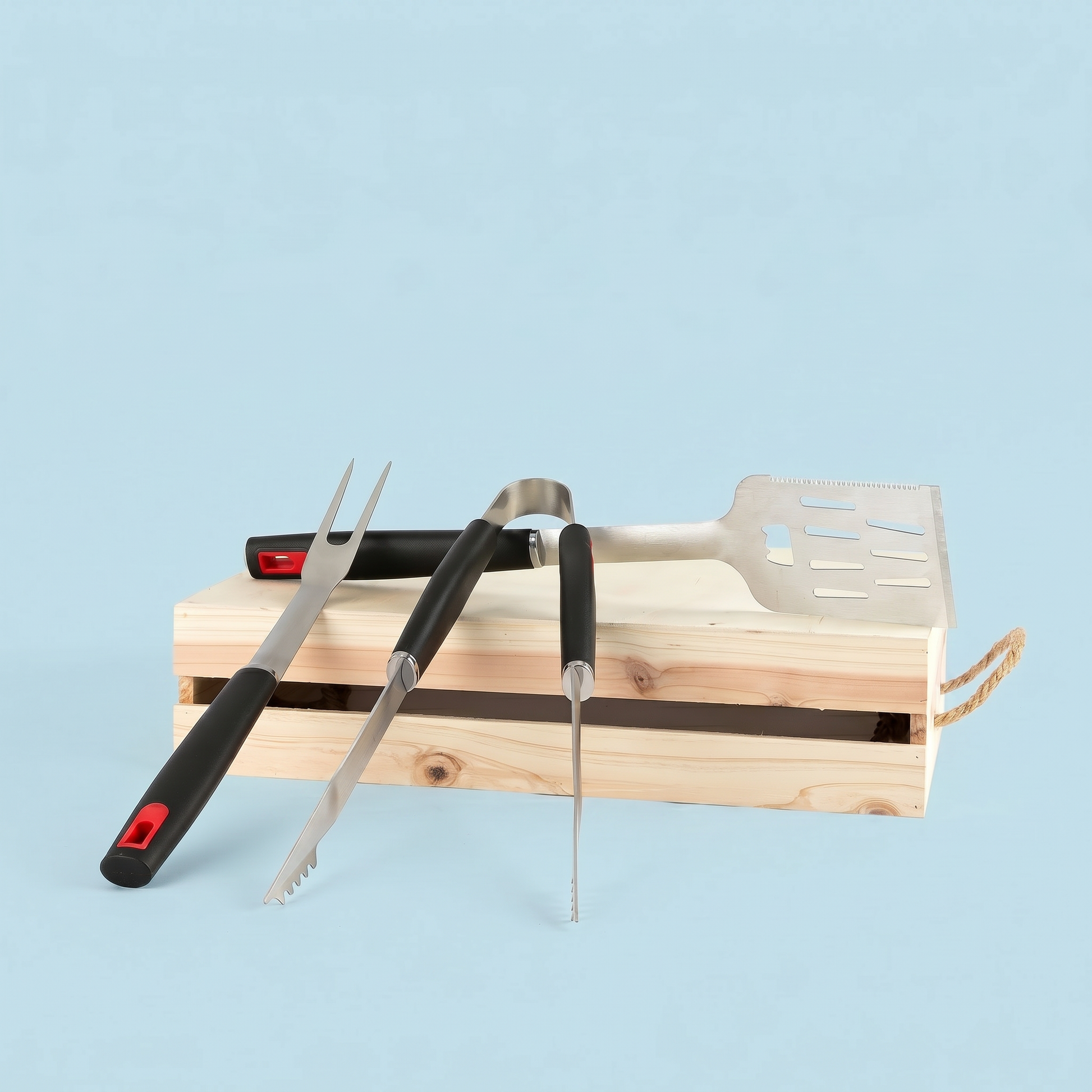 Set of barbecue tools including tongs, fork, and spatula on a wooden stand against a light blue background.