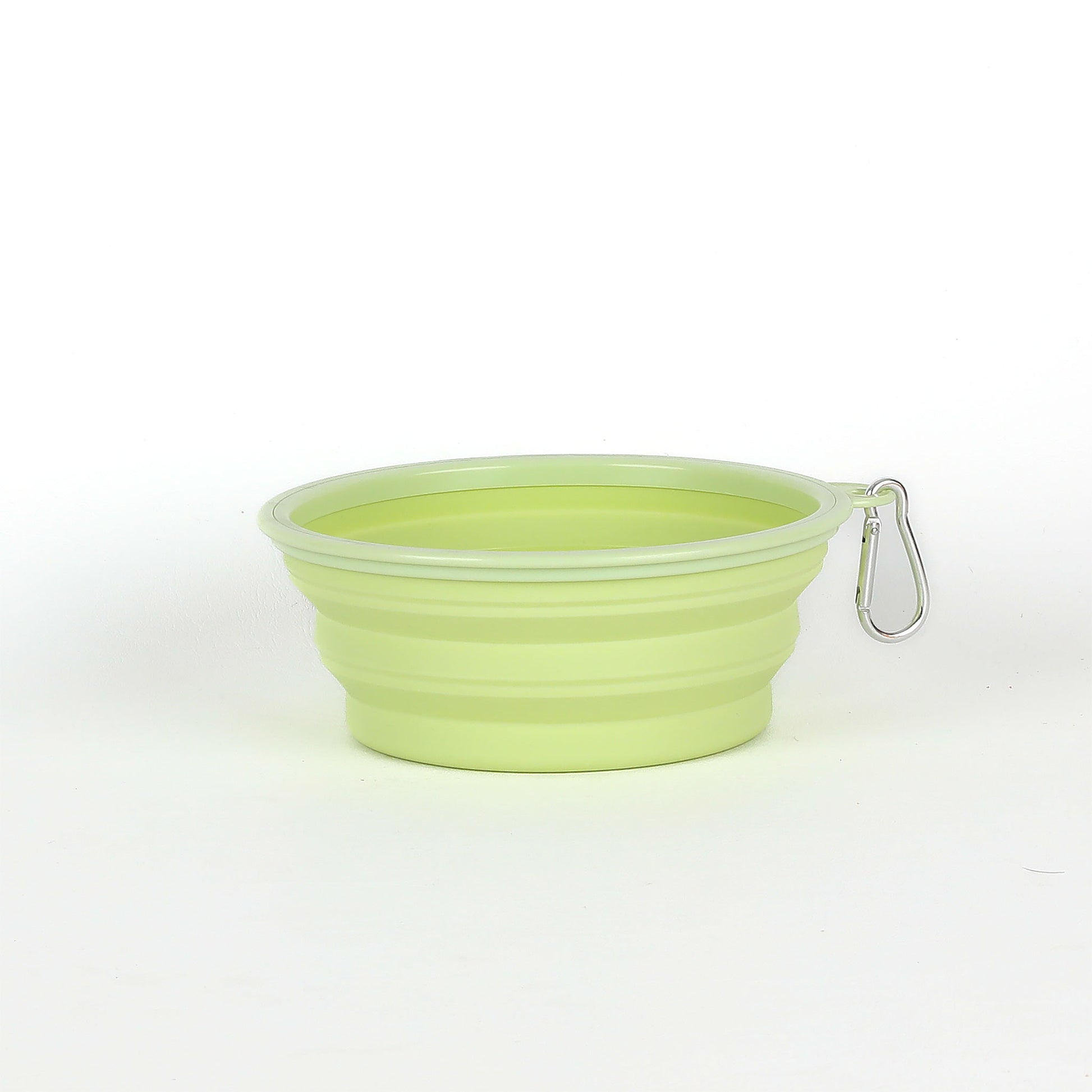 Green silicone bowl with a carabiner on a white background