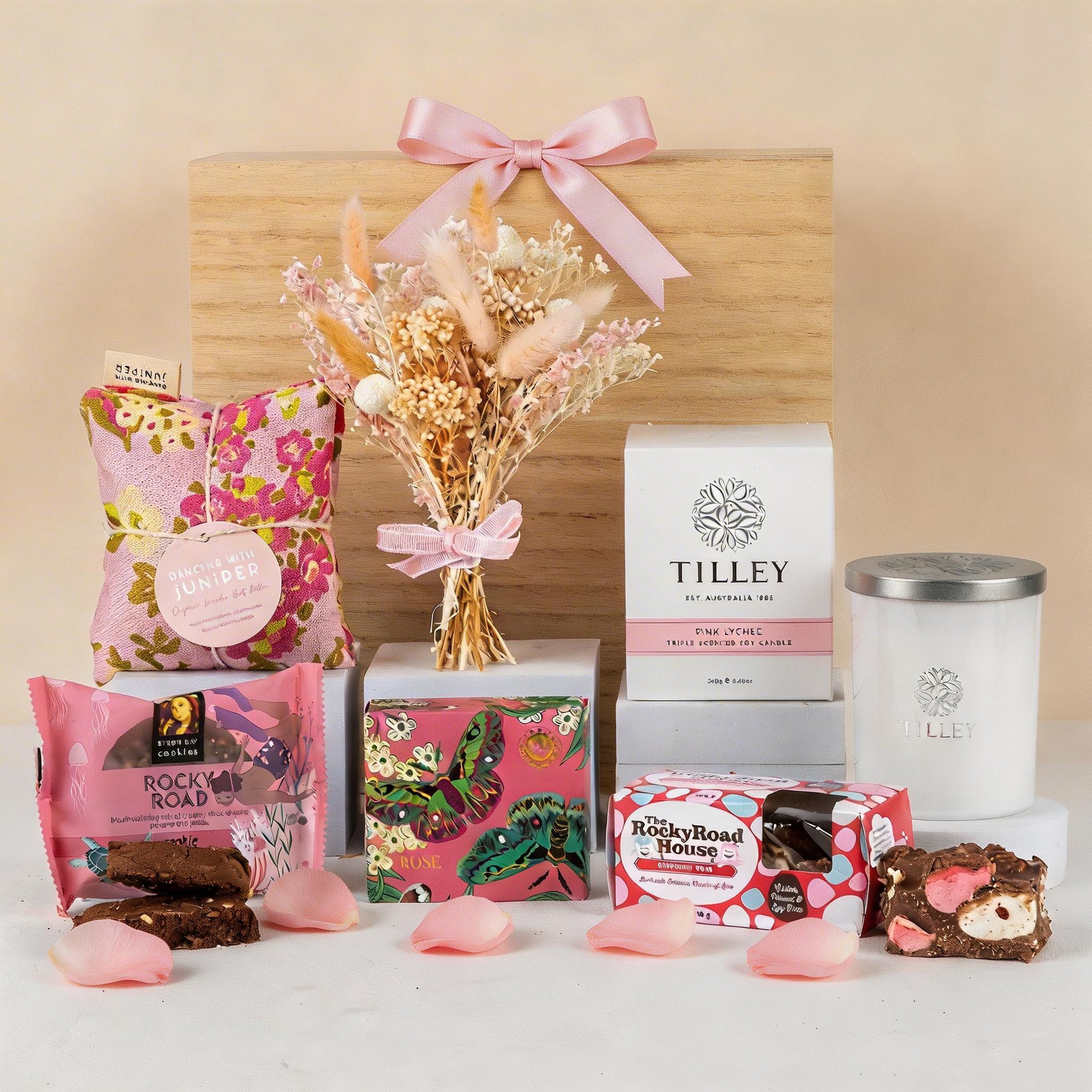 Gifting set with flowers, snacks, and a candle delivered nationwide