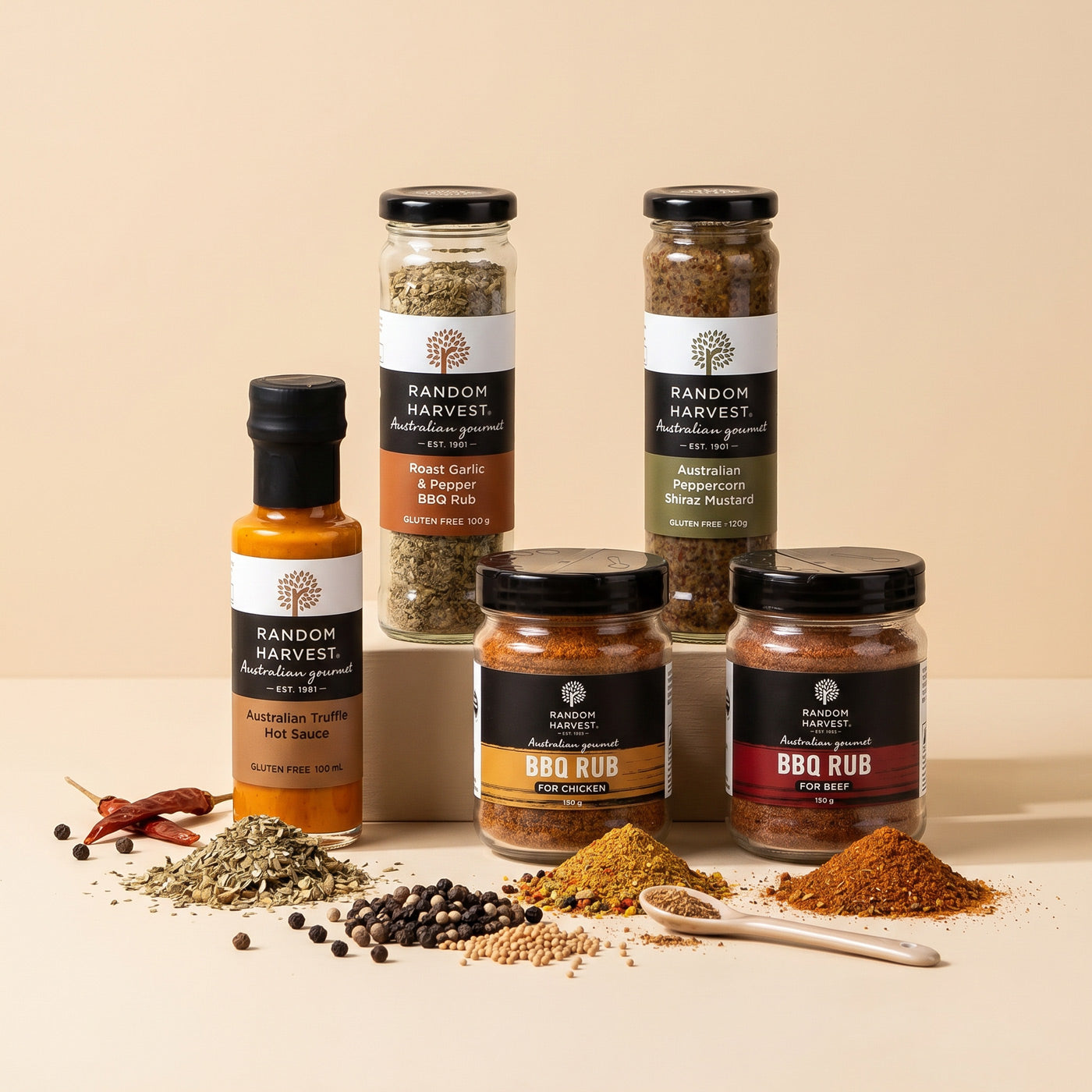 Collection of Random Harvest spice and seasoning jars on a beige background