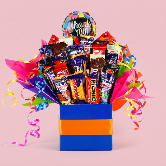 Colorful candy bouquet with a 'thank you' balloon on a pink background