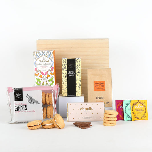 Assorted food products including cookies, tea, and biscuits on a white background