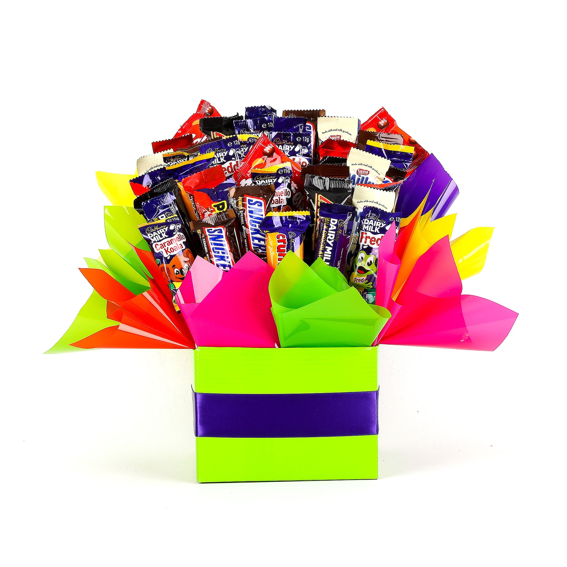 Colorful gift box filled with various chocolates on a white background