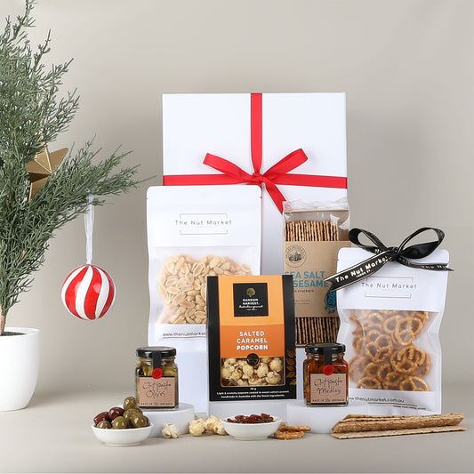 Gourmet gift set with snacks on a neutral background