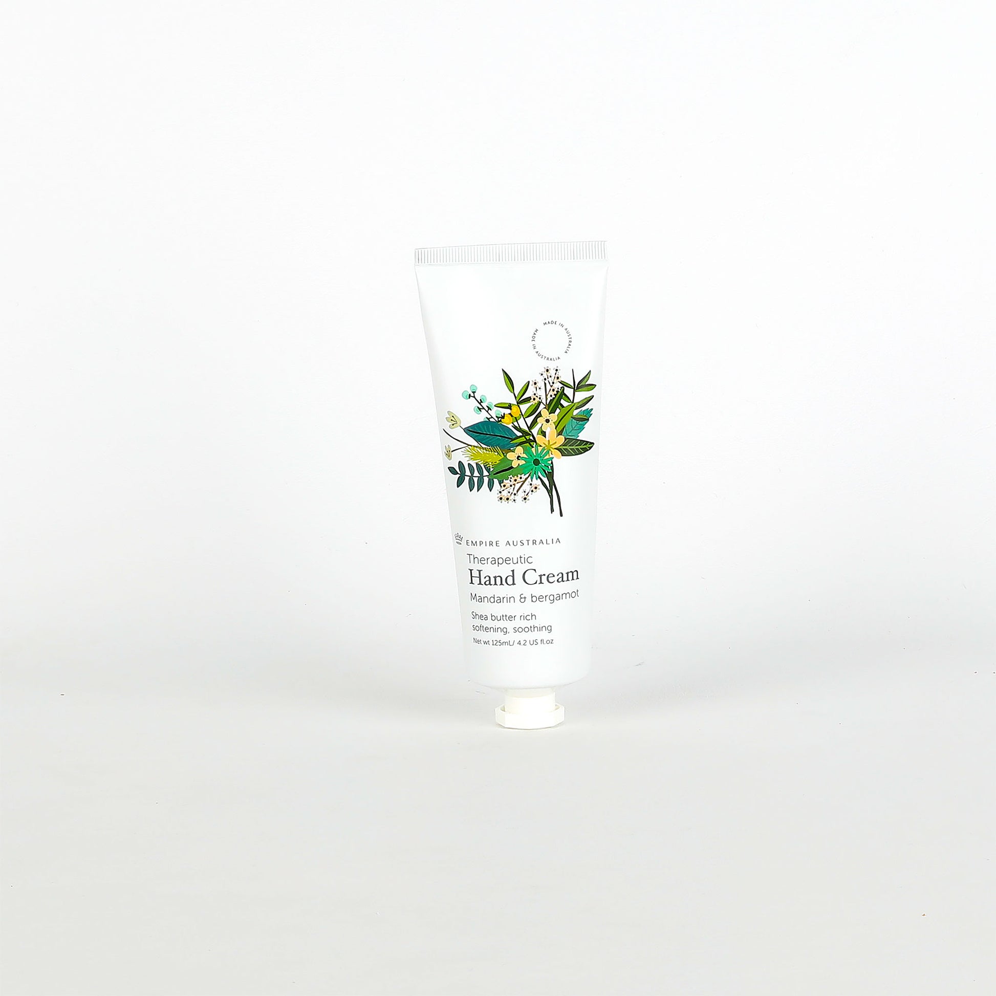 Hand cream with floral design on the label against a white background