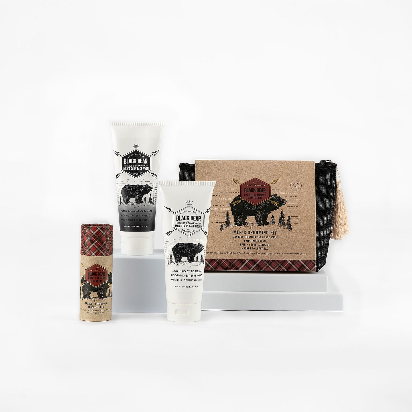 Black Bear men’s grooming kit with a selection of quality skincare essentials that include a daily face wash, face cream and body balm on a white background