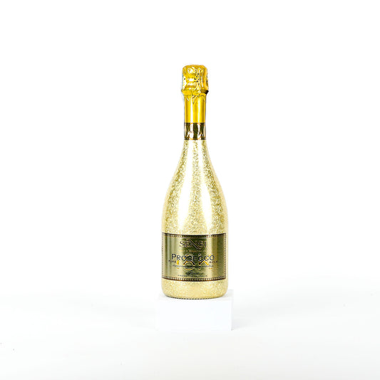 Gold sparkling wine bottle on a white background
