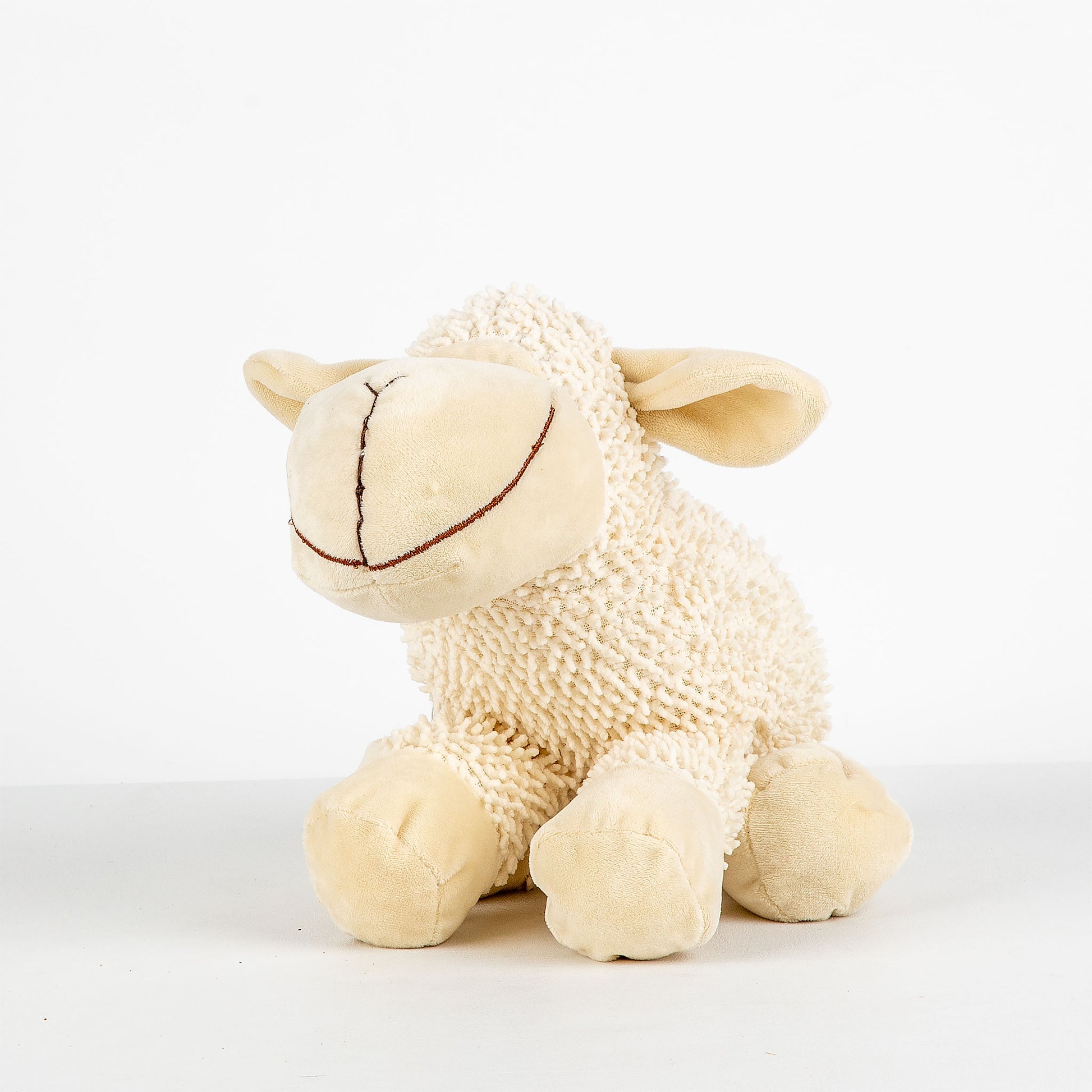 Plush toy sheep on a white background