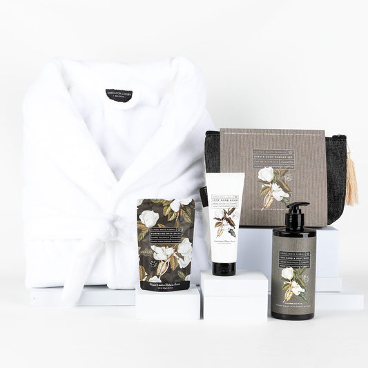 White robe & pamper products on a white background