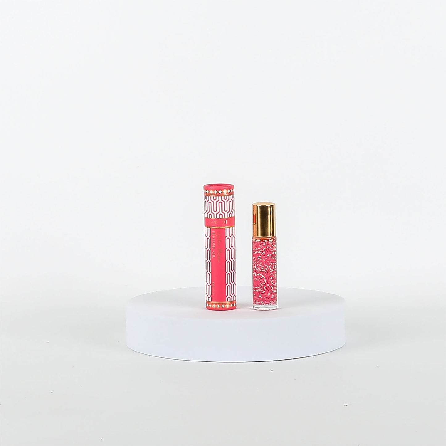 Pink MOR product on a white pedestal with a white background