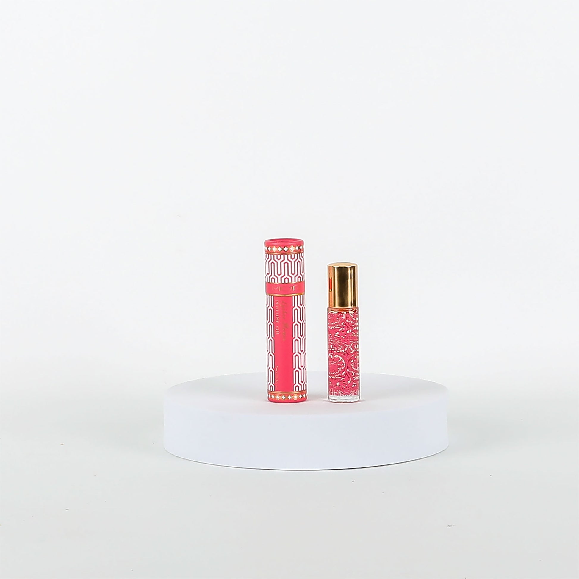 Pink MOR product on a white pedestal with a white background