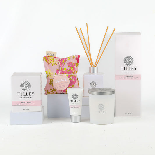 Tilley brand products including candle, diffuser, and cream on a white background