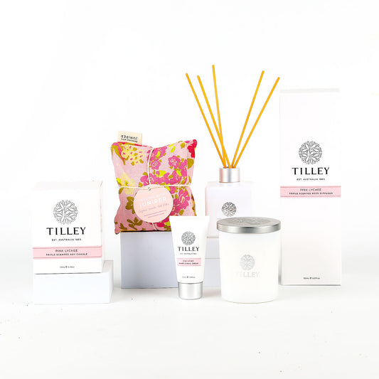 Tilley products including candle, diffuser, and hand cream on a white background