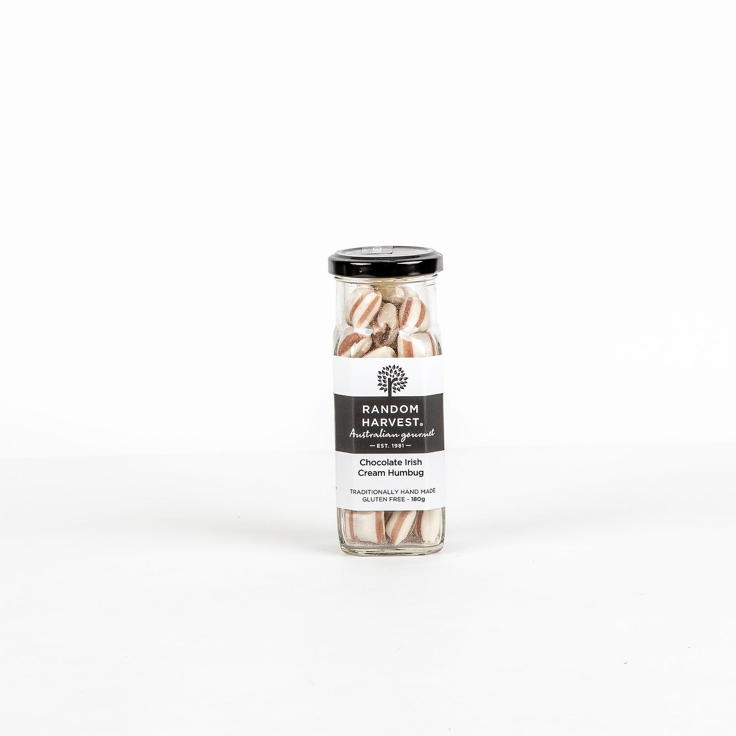Jar of chocolate Irish cream humbugs on a white background