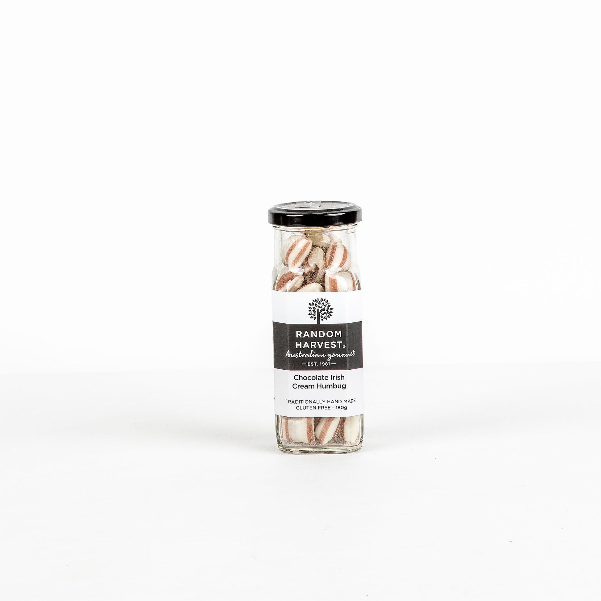 Jar of chocolate Irish cream humbugs on a white background