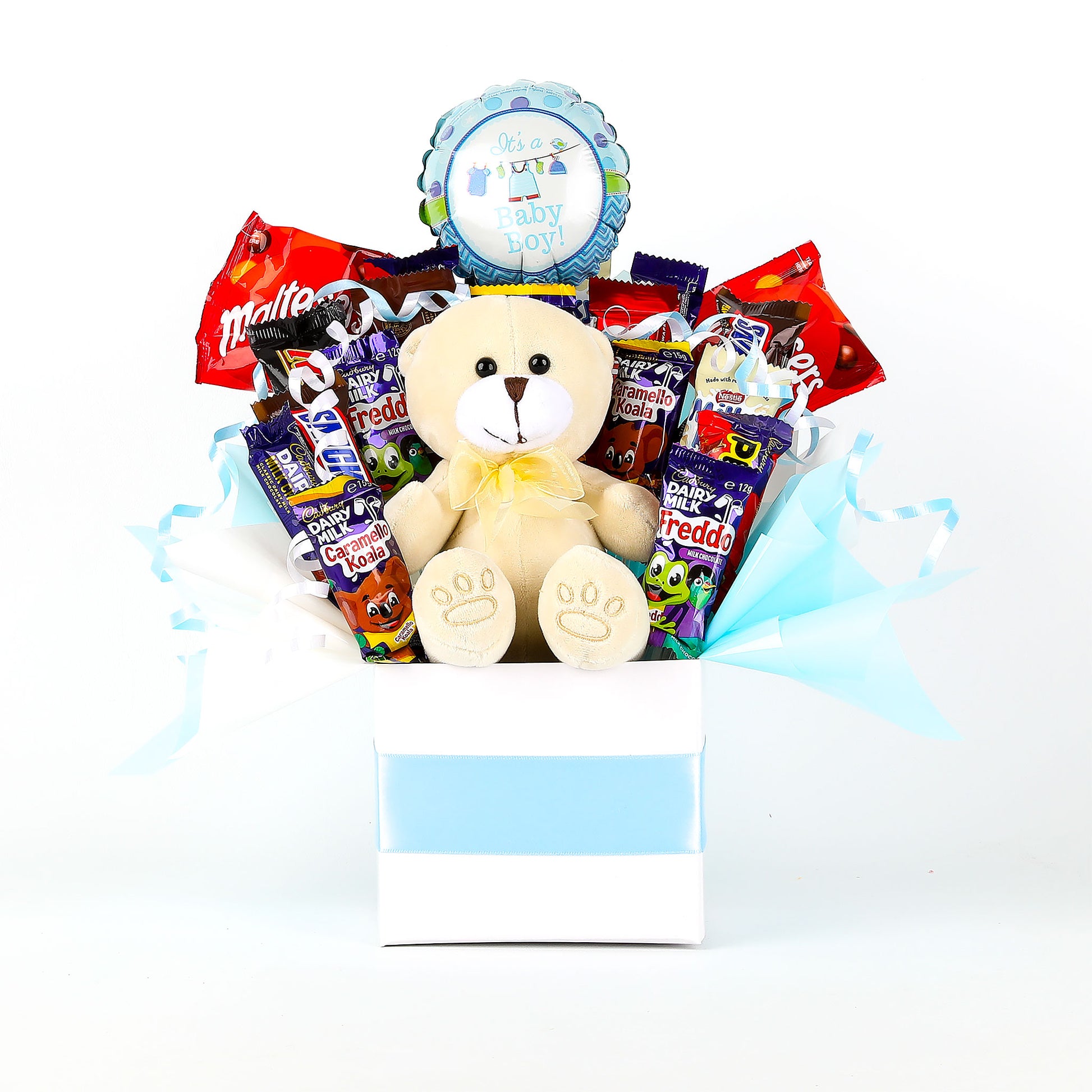 Gift basket with teddy bear, snacks, and a balloon on a white background