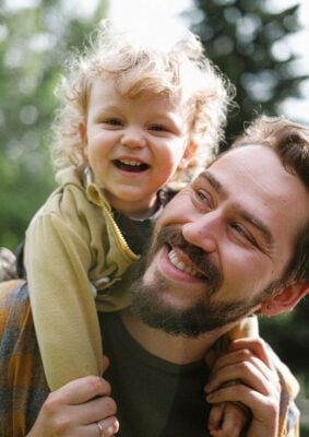 Father with child on his back